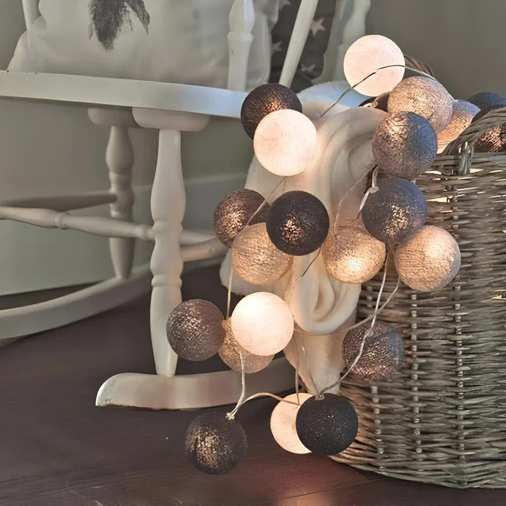 Battery operated cotton ball string lights, perfect for outdoor events or power-free zones.