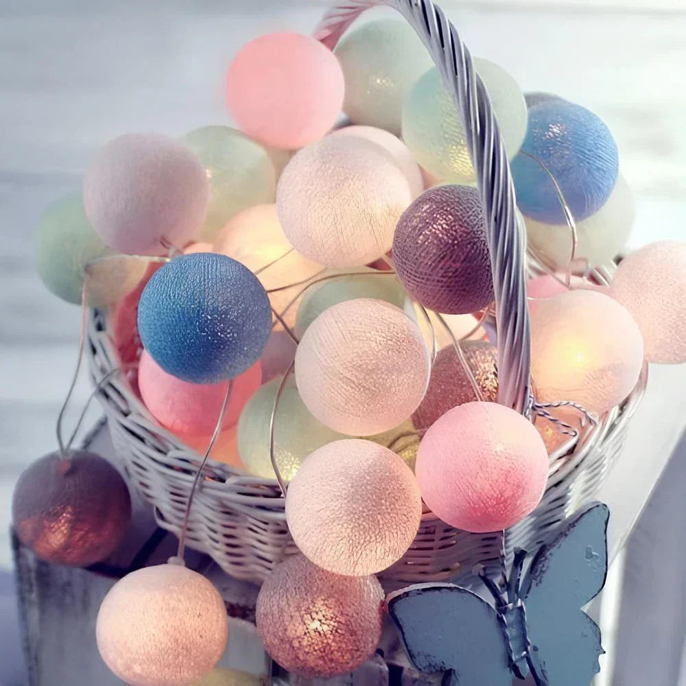 Party lights: colorful cotton ball string adding a playful touch to any celebration.