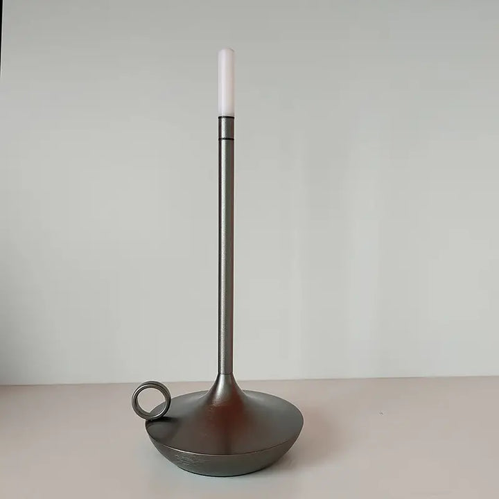 Decorative wireless LED table lamp, unique candle holder providing soft ambient lighting.