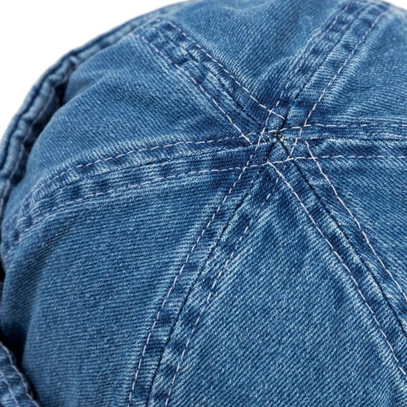 Versatile unisex denim baseball cap with a roll-up brim. Adjustable for all, perfect for casual outdoor style.
