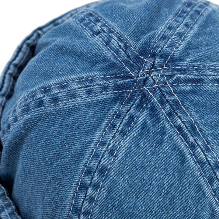 Versatile unisex denim baseball cap with a roll-up brim. Adjustable for all, perfect for casual outdoor style.