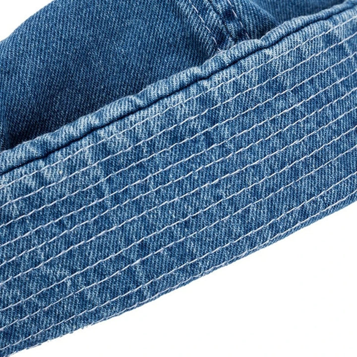 Close-up of the durable denim fabric on a unisex adjustable baseball cap, highlighting quality & style.