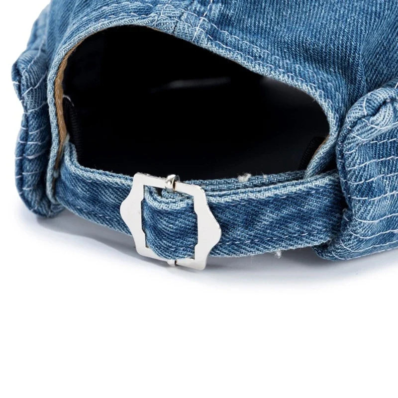 Person wearing a unisex denim roll-up baseball cap, showcasing its comfortable streetwear look.