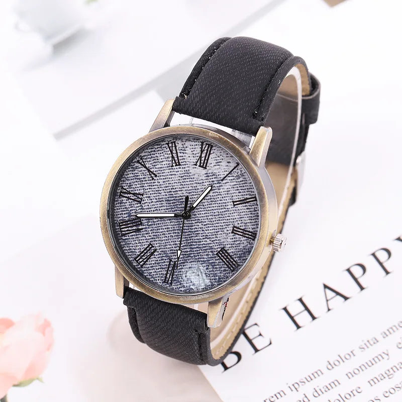 Elegant bronze bezel unisex watch paired with a sturdy blue denim strap, offering a timeless casual style.