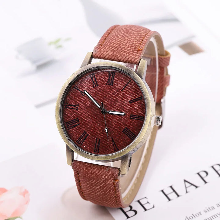 Stylish unisex denim watch with bronze features, ideal as a statement everyday accessory.
