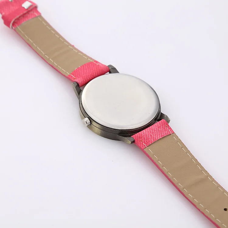 Unisex fashion watch with a denim strap & bronze accents, an essential casual wristwear.