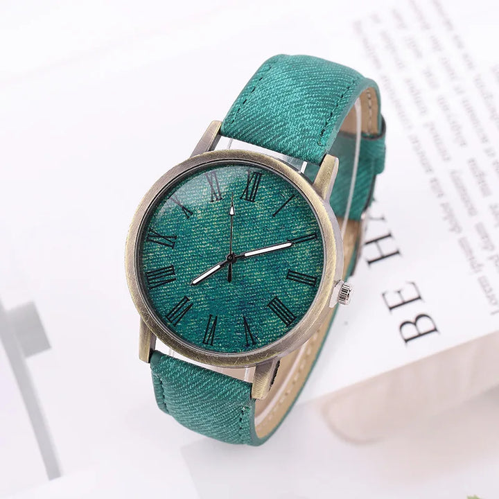Durable unisex denim strap watch, stylish with bronze accents, perfect for daily wear.