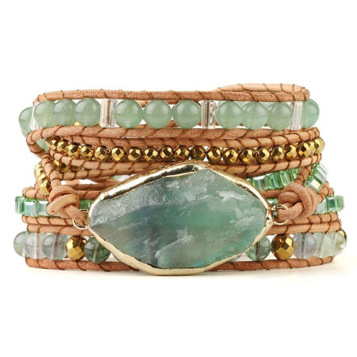 Model wearing a unisex fluorite wrap bracelet, showcasing its multi-strand design