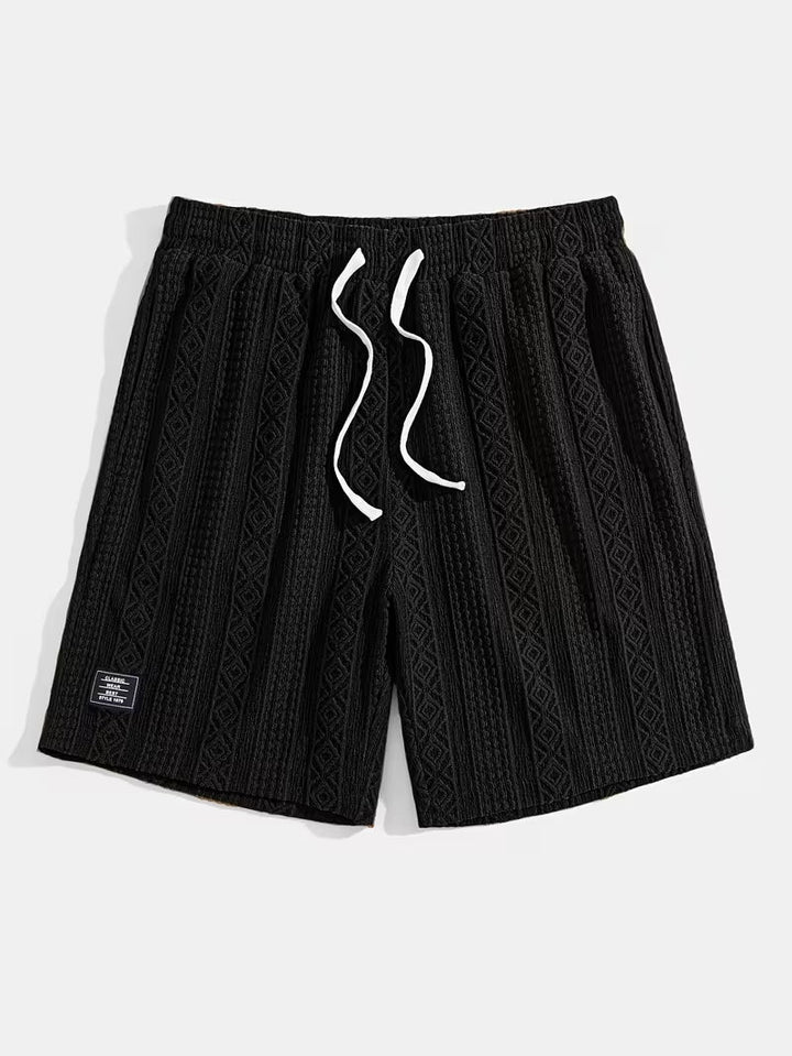 Unisex relaxed fit knit lounge shorts featuring a stylish diamond pattern.