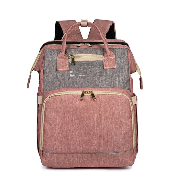 Diaper travel bag with sturdy straps attached to a stroller, offering convenient hands-free parenting.