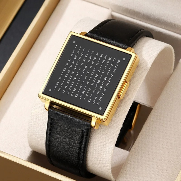 Close-up of modern digital watch with unique LED word display, showing time.