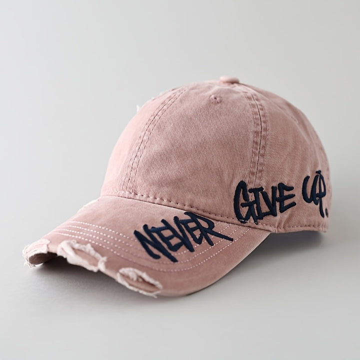 Adjustable unisex denim baseball cap with "Never Give Up" graffiti-style embroidery. Perfect casual headwear.