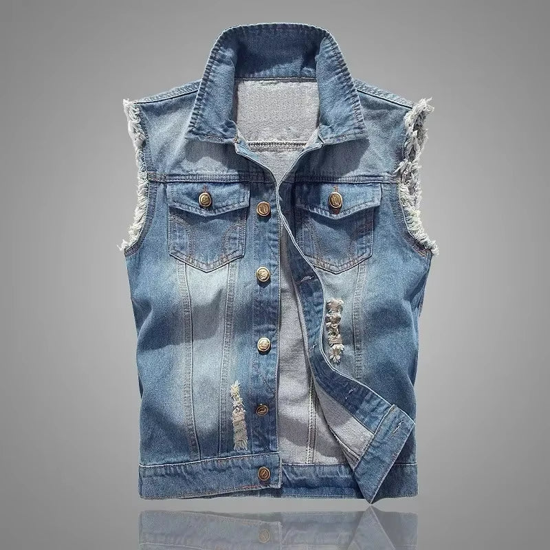 Edgy unisex sleeveless denim vest with extensive distressing, perfect for layering outerwear.