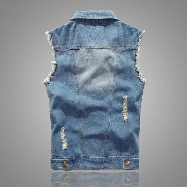 Rugged heavyweight distressed denim vest, a unisex staple for bold punk style and streetwear.