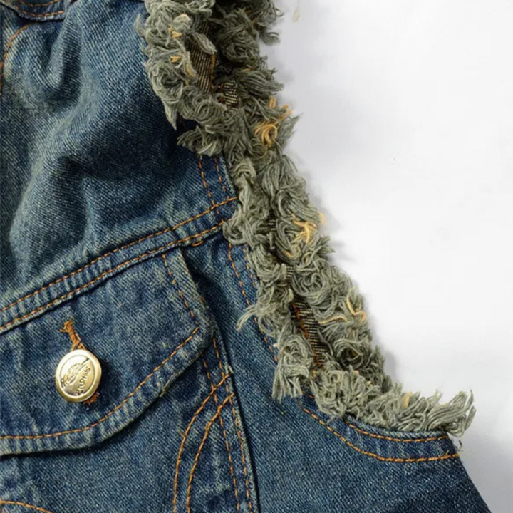 Fashionable unisex distressed denim vest, showcasing rips and tears for an authentic edgy style.