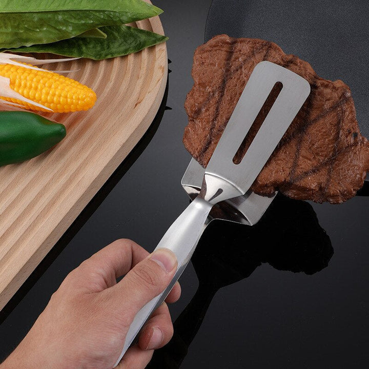 Unisex double-sided stainless steel spatula for easy flipping pancakes, eggs, and burgers on the grill or stove.