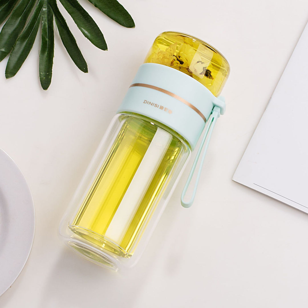Unisex double-walled glass water bottle with tea infuser. Insulated for hot & cold drinks. Portable.