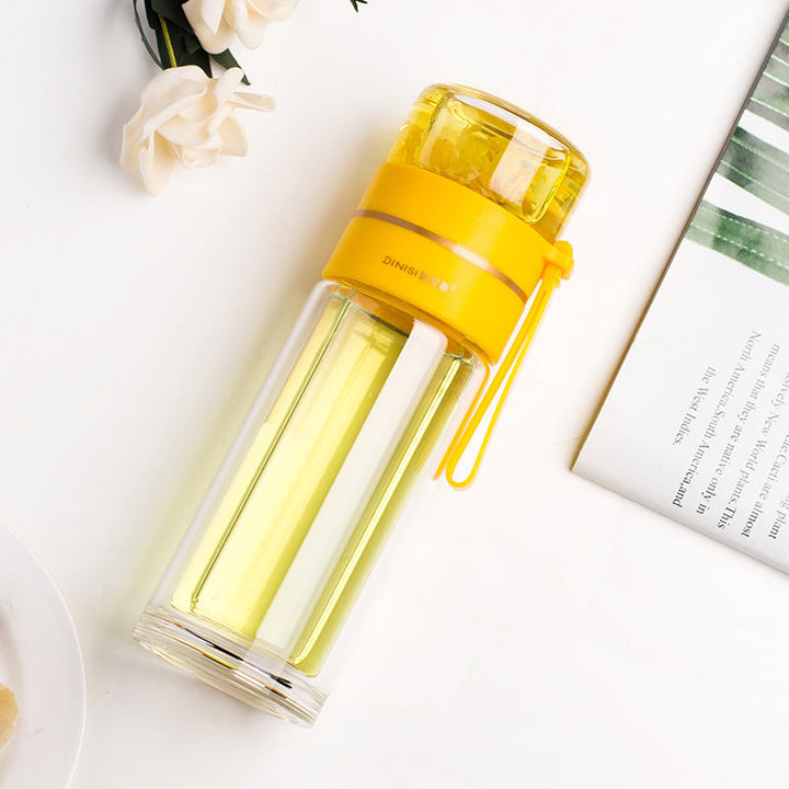 Insulated glass water bottle with tea infuser. Double-wall design for hot and cold beverages. Portable.