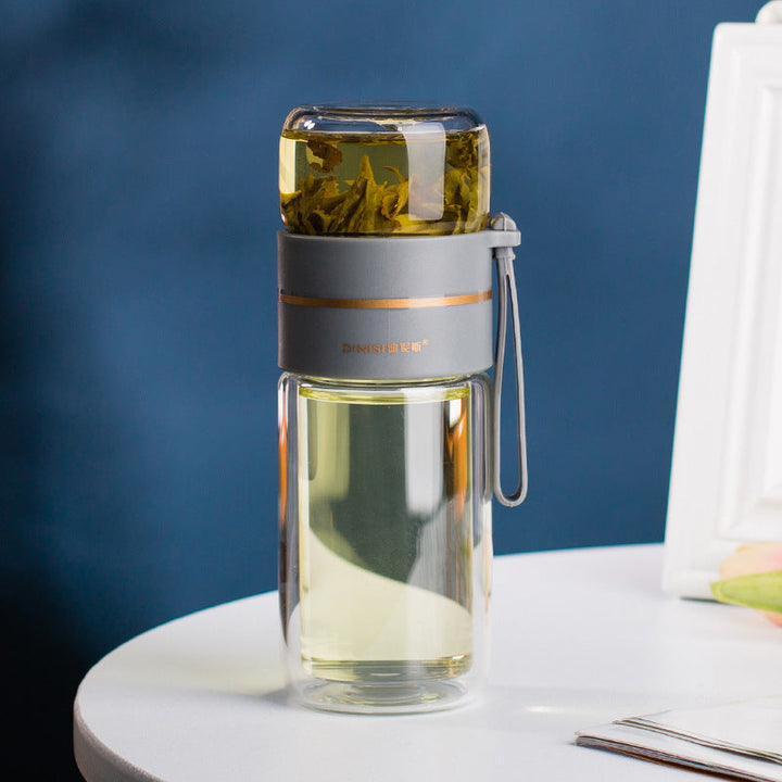 Multi-use double-walled glass bottle. Perfect for hot tea, cold brew, or fruit-infused water. Leak-proof.
