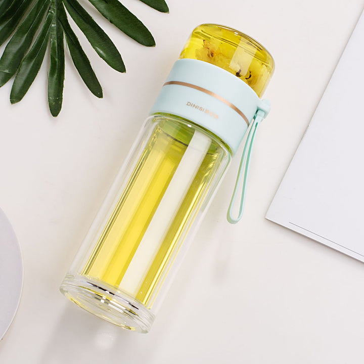Eco-friendly double-walled glass water bottle with tea infuser. Reusable, sustainable, insulated drinkware.