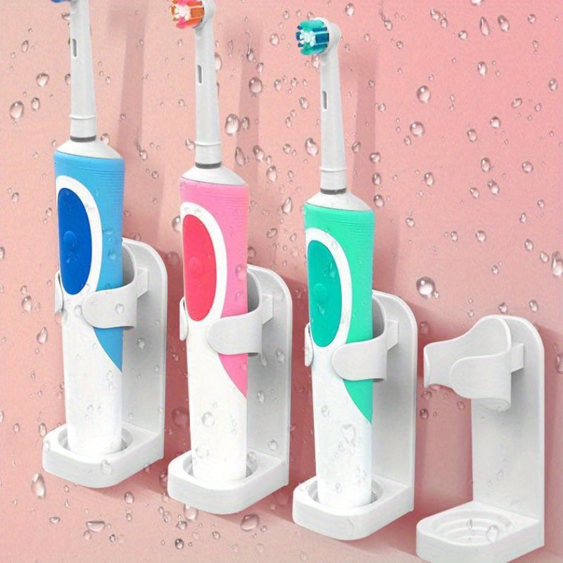 Home essential: wall-mounted electric toothbrush holder set in white plastic, perfect for family bathroom organization.