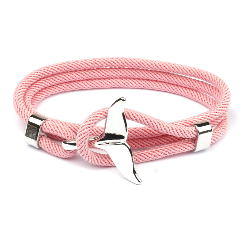 Close-up: elegant anchor charm on an adjustable stainless steel bracelet.