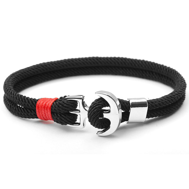 Nautical charm bracelet, adjustable fit, showcasing a detailed anchor design.