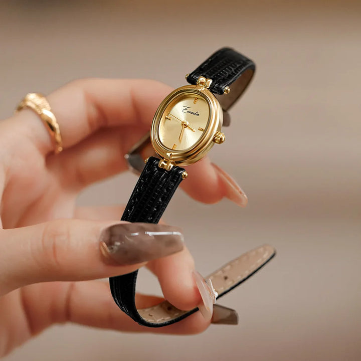 Unisex elegant faux leather watch with gold-tone accents. A versatile fashion accessory for any occasion.