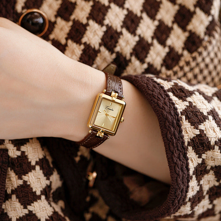 Two elegant unisex watches: a square and an oval. Both feature faux leather straps & gold-tone details.