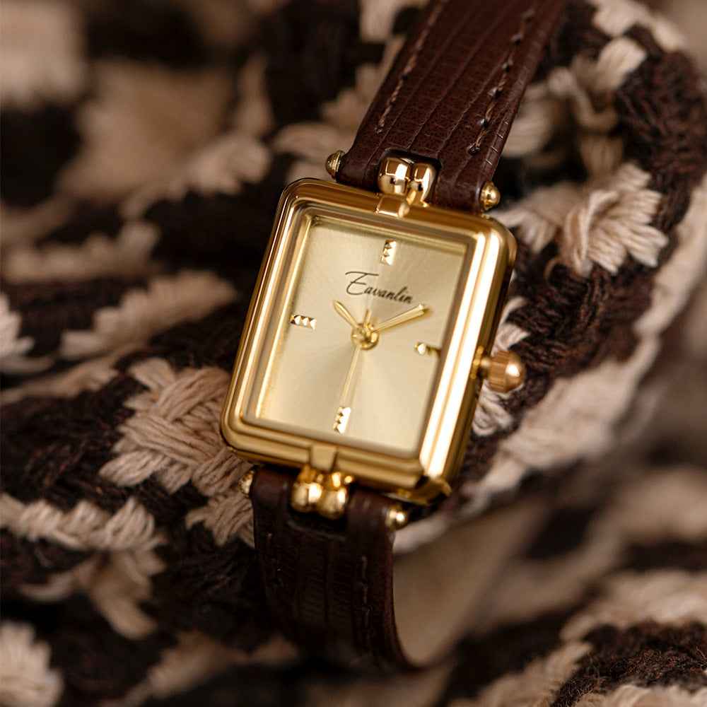 Sophisticated oval faux leather watch. A timeless gold-tone wristwatch, ideal unisex fashion accessory.