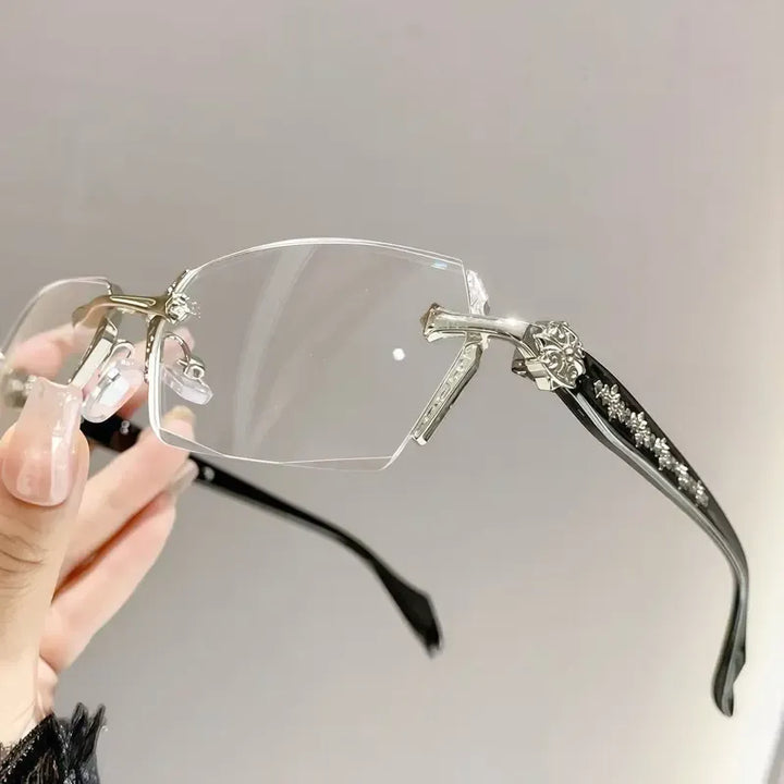 Unisex elegant rimless glasses with clear lenses & metal temples. Lightweight & sophisticated optical eyewear.