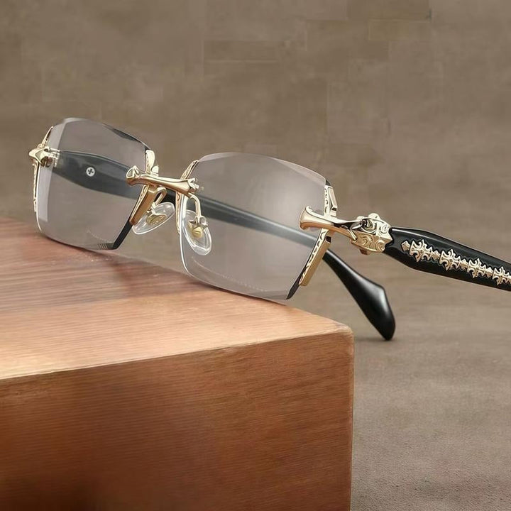 Elegant unisex rimless glasses featuring a subtle crystal detail on metal temples. Sophisticated lightweight reading eyewear.