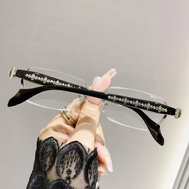 Lightweight unisex rimless optical glasses for comfortable everyday wear. Elegant metal frames with clear lenses.