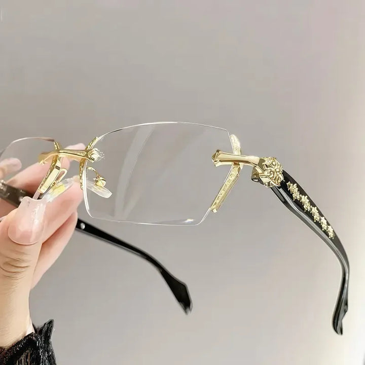 Sophisticated unisex rimless eyewear with elegant metal design. Clear lenses and a lightweight feel for optical clarity.