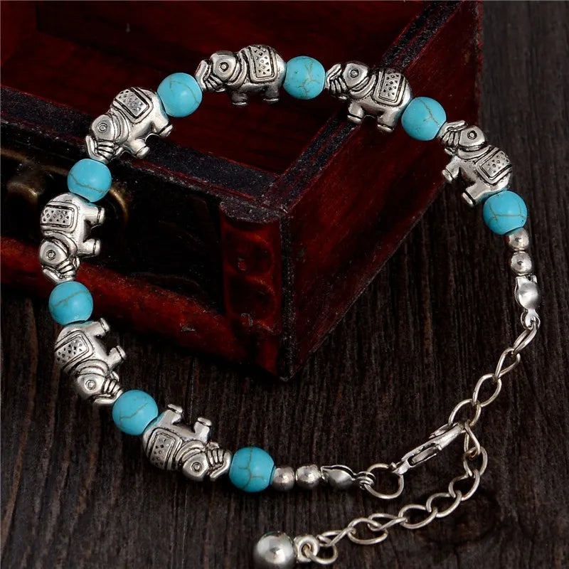 Adjustable boho elephant bracelet, symbolizing wisdom & strength, with sparkling crystal beads.