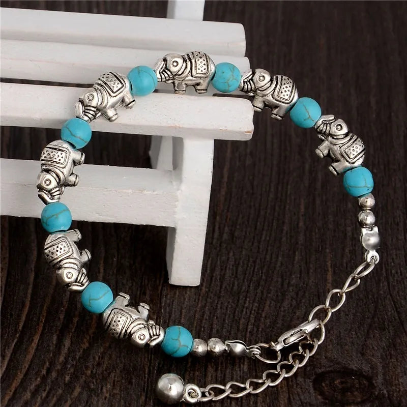 Elegant unisex elephant bracelet with faceted crystal beads and detailed silver charm, spiritual boho style.