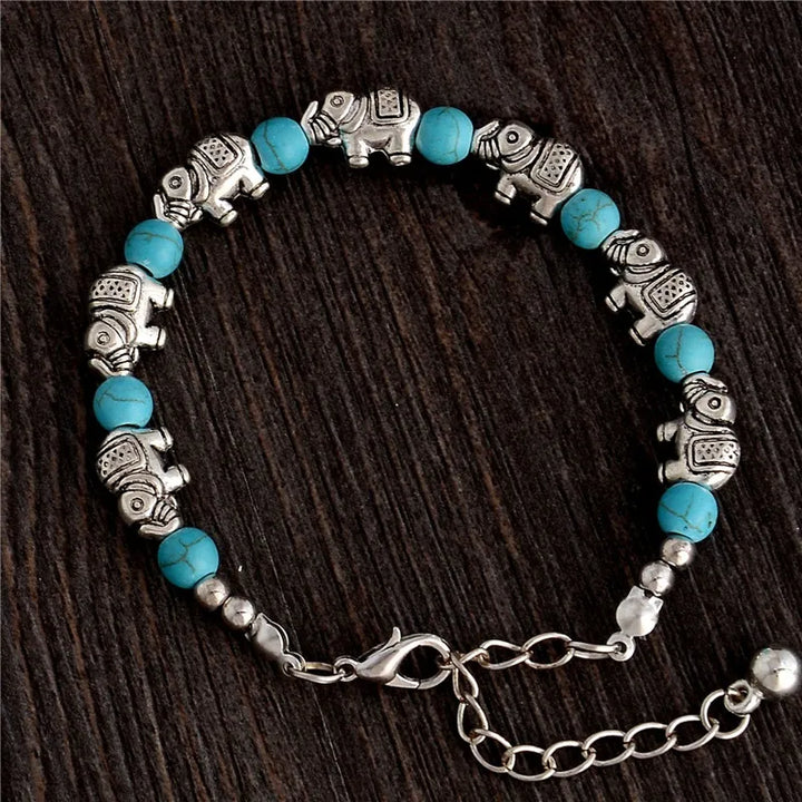 Embrace wisdom & strength with this adjustable crystal & silver elephant charm boho bracelet.
