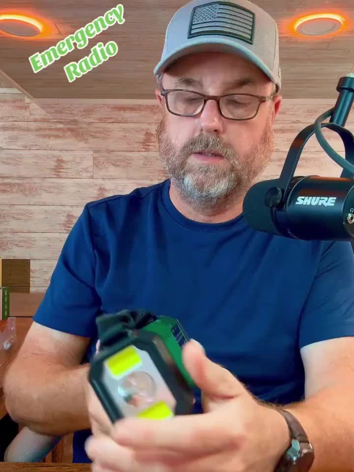 Multifunctional emergency radio: AM/FM/NOAA, LED flashlight, USB charger, solar, and hand crank for survival.