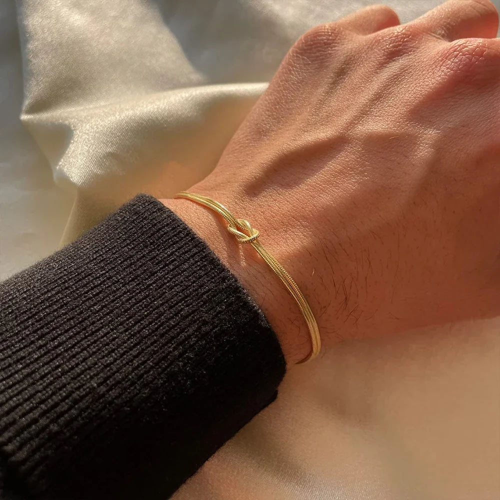 Unisex Endless Knot Bracelet crafted from durable stainless steel. Minimalist adjustable jewelry for men & women.