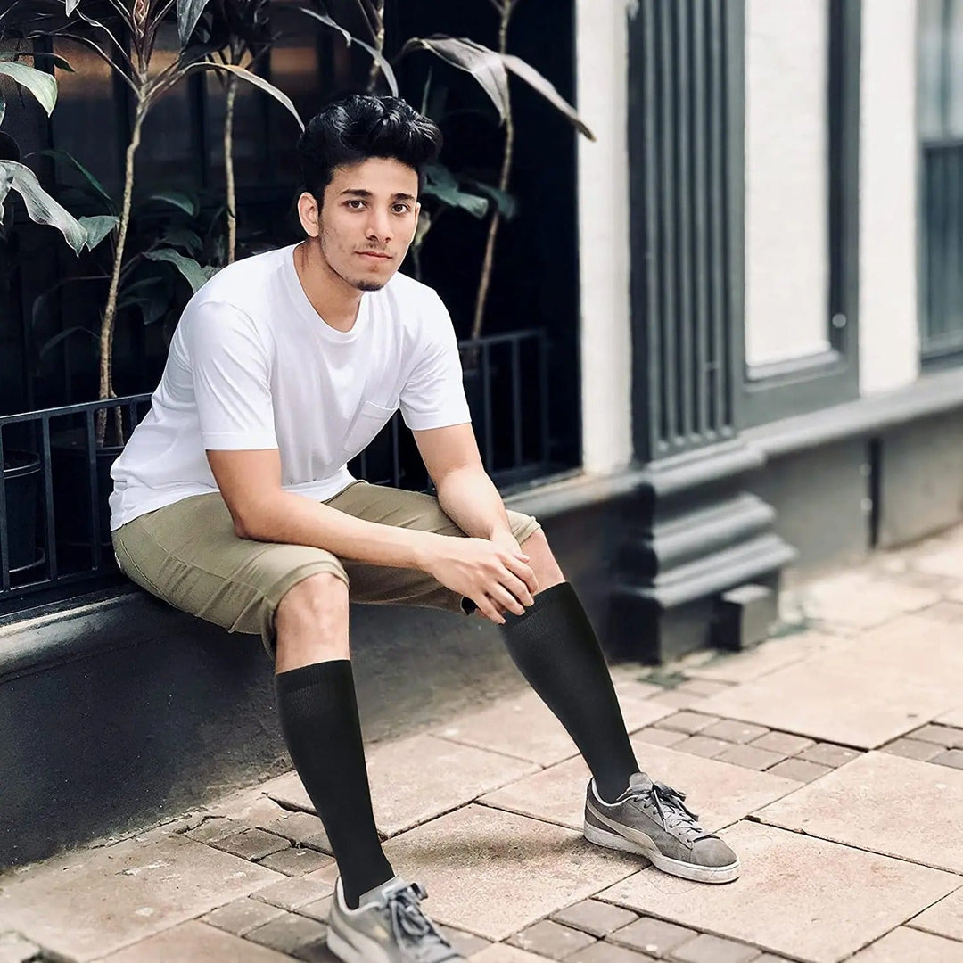 Energizing unisex compression socks provide superior leg support, boosting circulation for comfort & anti-fatigue relief.