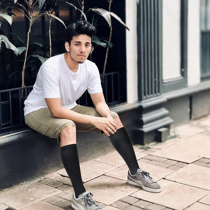 Energizing unisex compression socks provide superior leg support, boosting circulation for comfort & anti-fatigue relief.