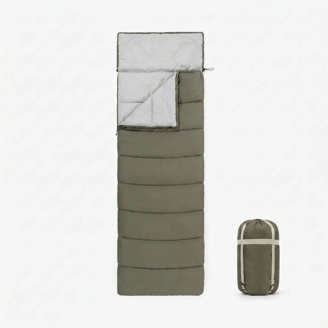 Durable unisex envelope sleeping bag with cotton fill for comfortable camping and hiking outdoor adventures.