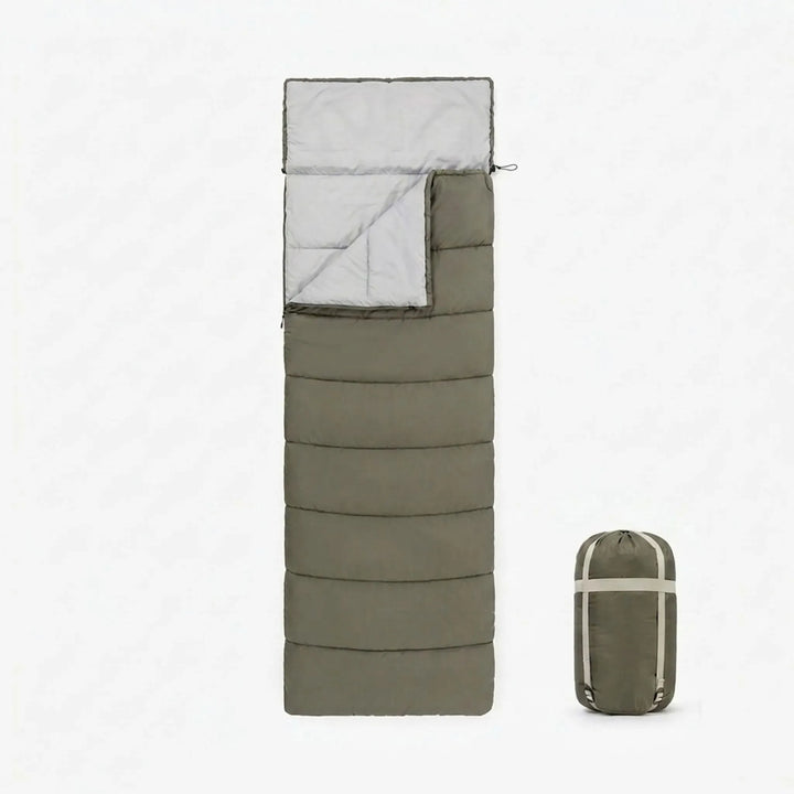 Durable unisex envelope sleeping bag with cotton fill for comfortable camping and hiking outdoor adventures.