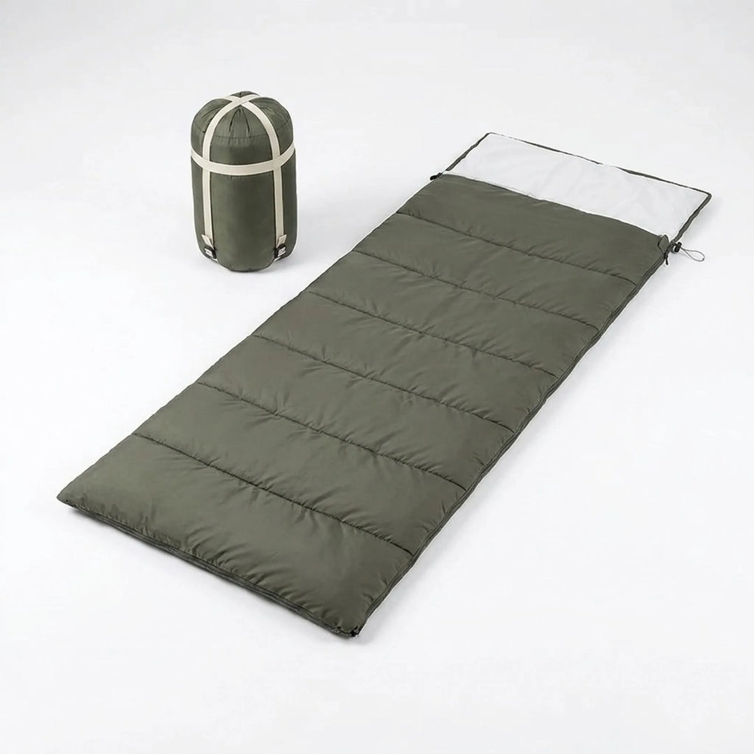 Lightweight unisex envelope sleeping bag with soft cotton fill, essential travel gear for hiking & camping.