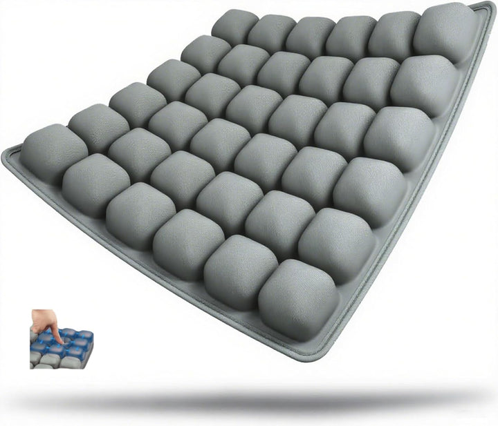 Ergonomic inflatable travel seat cushion for camping, providing portable comfort and pressure relief outdoors.