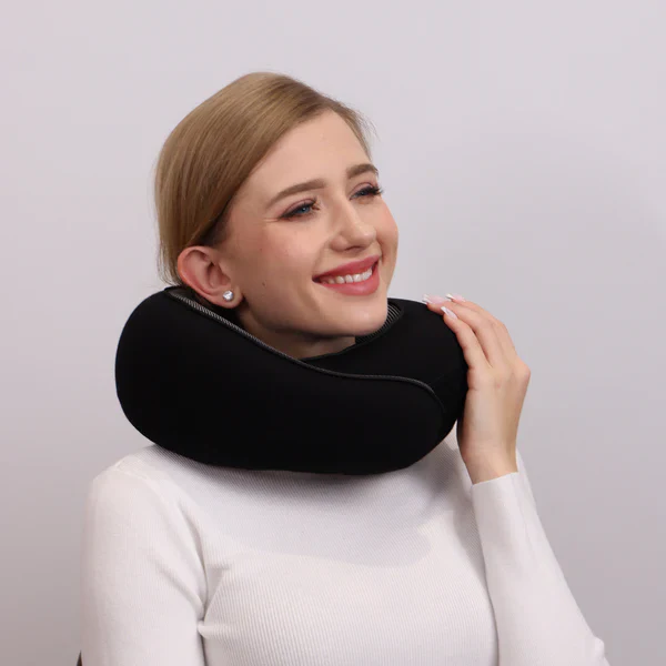 Ergonomic travel neck pillow, designed for optimal neck support & comfort, a portable essential for long journeys & relaxation.