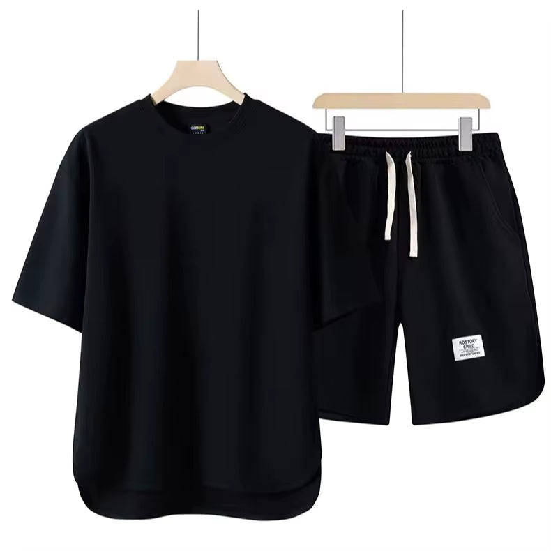 Versatile unisex essential lounge set. Comfortable two-piece cotton blend, ideal for relaxed casual wear or athleisure.