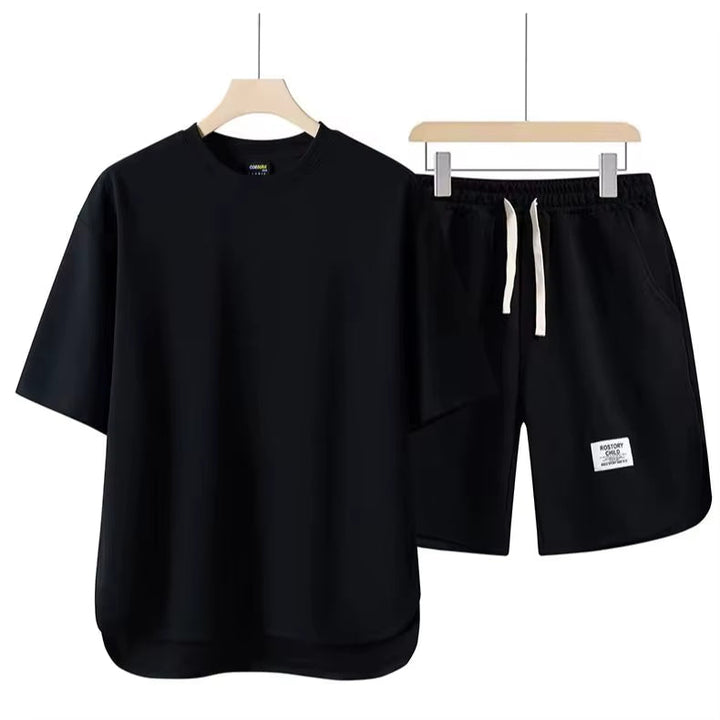 Versatile unisex essential lounge set. Comfortable two-piece cotton blend, ideal for relaxed casual wear or athleisure.