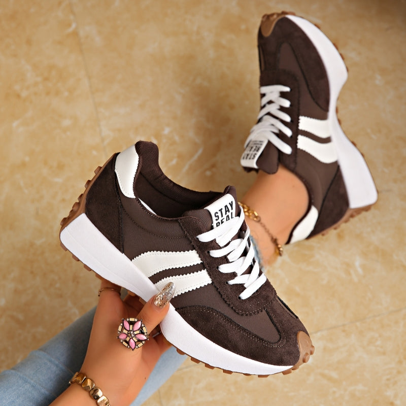 Athletic walking shoes with a comfortable platform sole and essential arch support for active individuals.