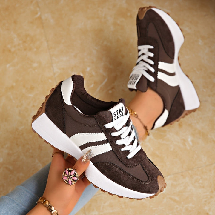 Athletic walking shoes with a comfortable platform sole and essential arch support for active individuals.